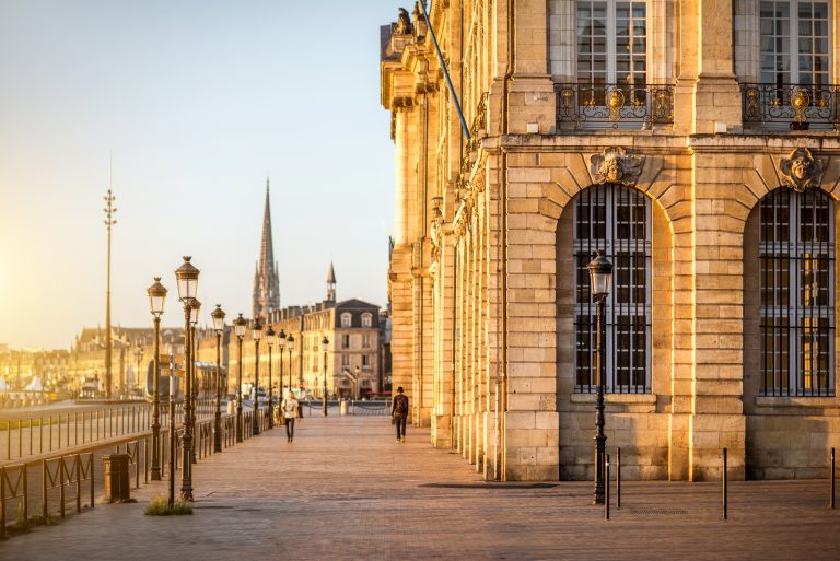 Street view ner the famous La Bourse square during the morning in Bordeaux city, France