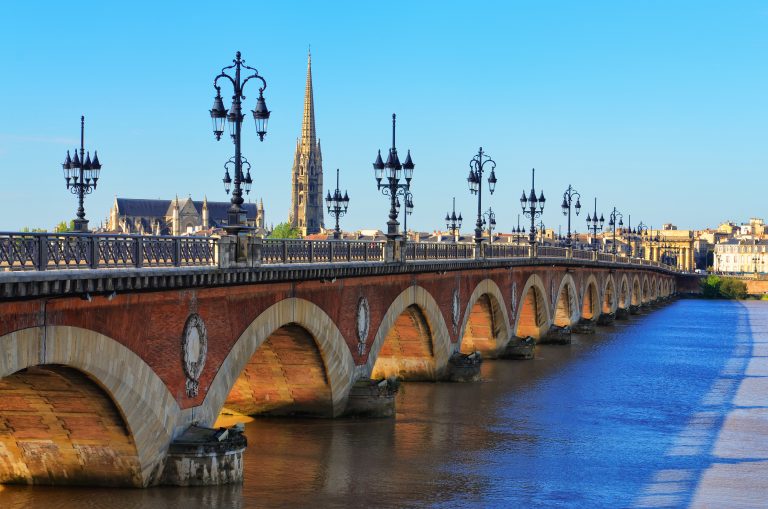 Bordeaux river bridge with St Michel cathedral in background, France